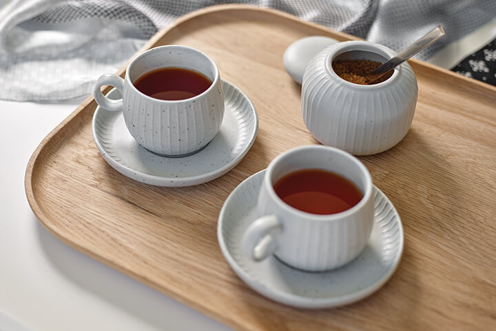 Two cups of black tea, with saucers, on a tray with sugar bowl, Life Care Gaynes Park Suites